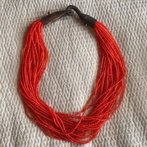 Deep orange needed necklace with wooden clasp